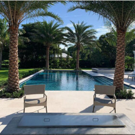 View of a pool in an elegant backyard.