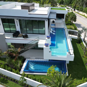 A double treat for pool lovers. The top pool of the house is cantilevered over the lower pool on the ground floor.